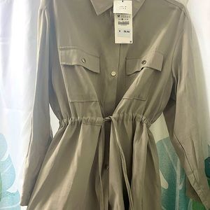 A dress from Zara. It's tan &it ties on the waist to give that beautiful figure.